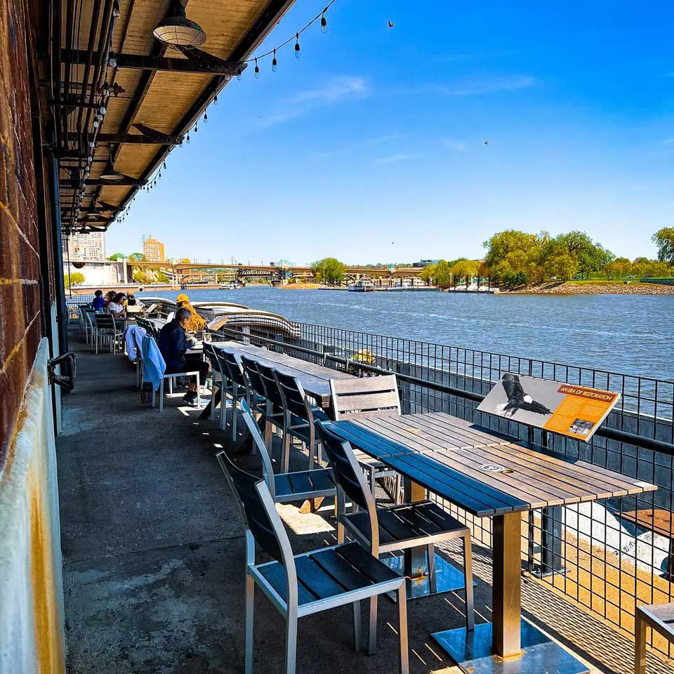 Patio at City House with the Mississippi River in the background