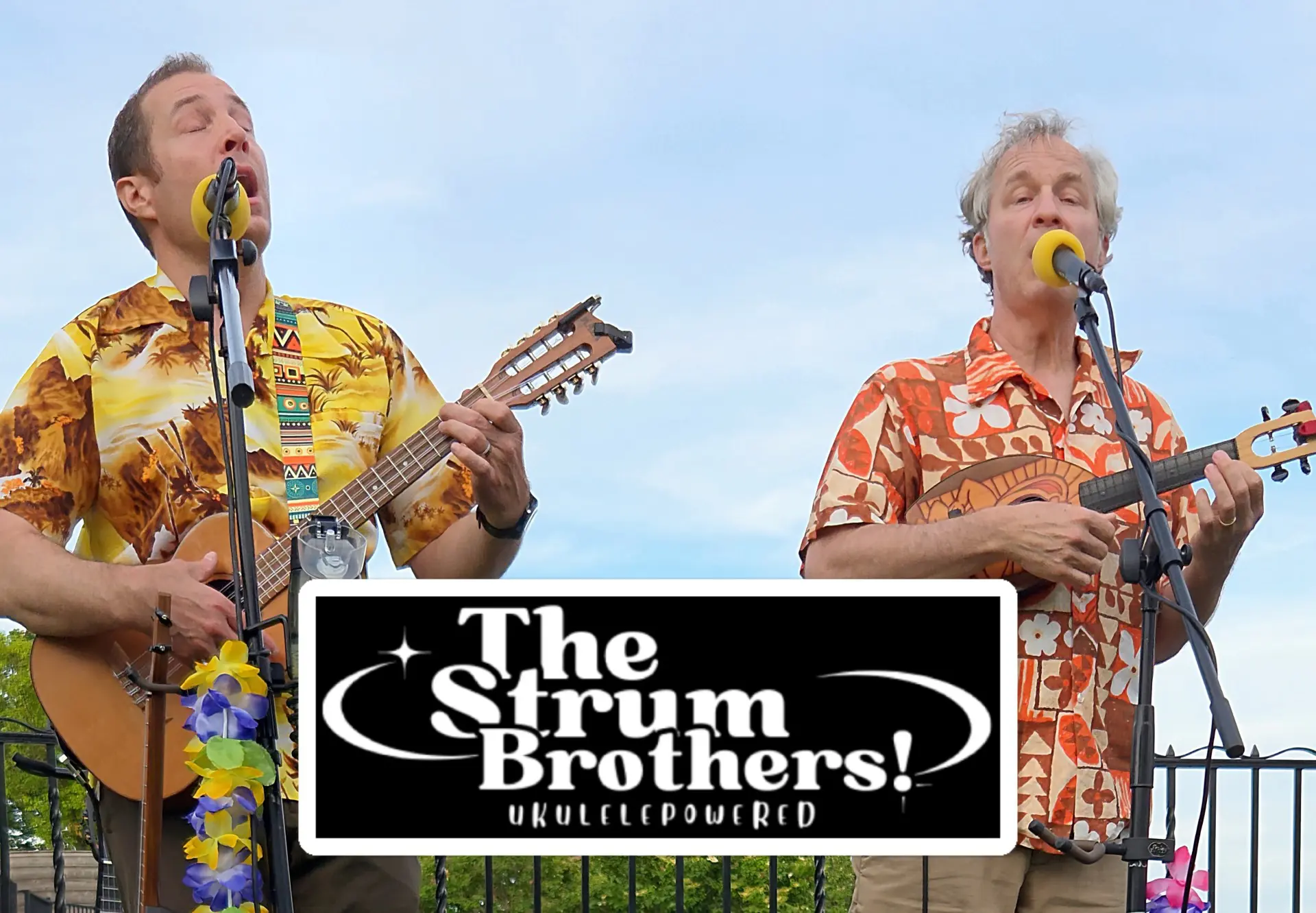 The Strum Brothers playing ukuleles and singing